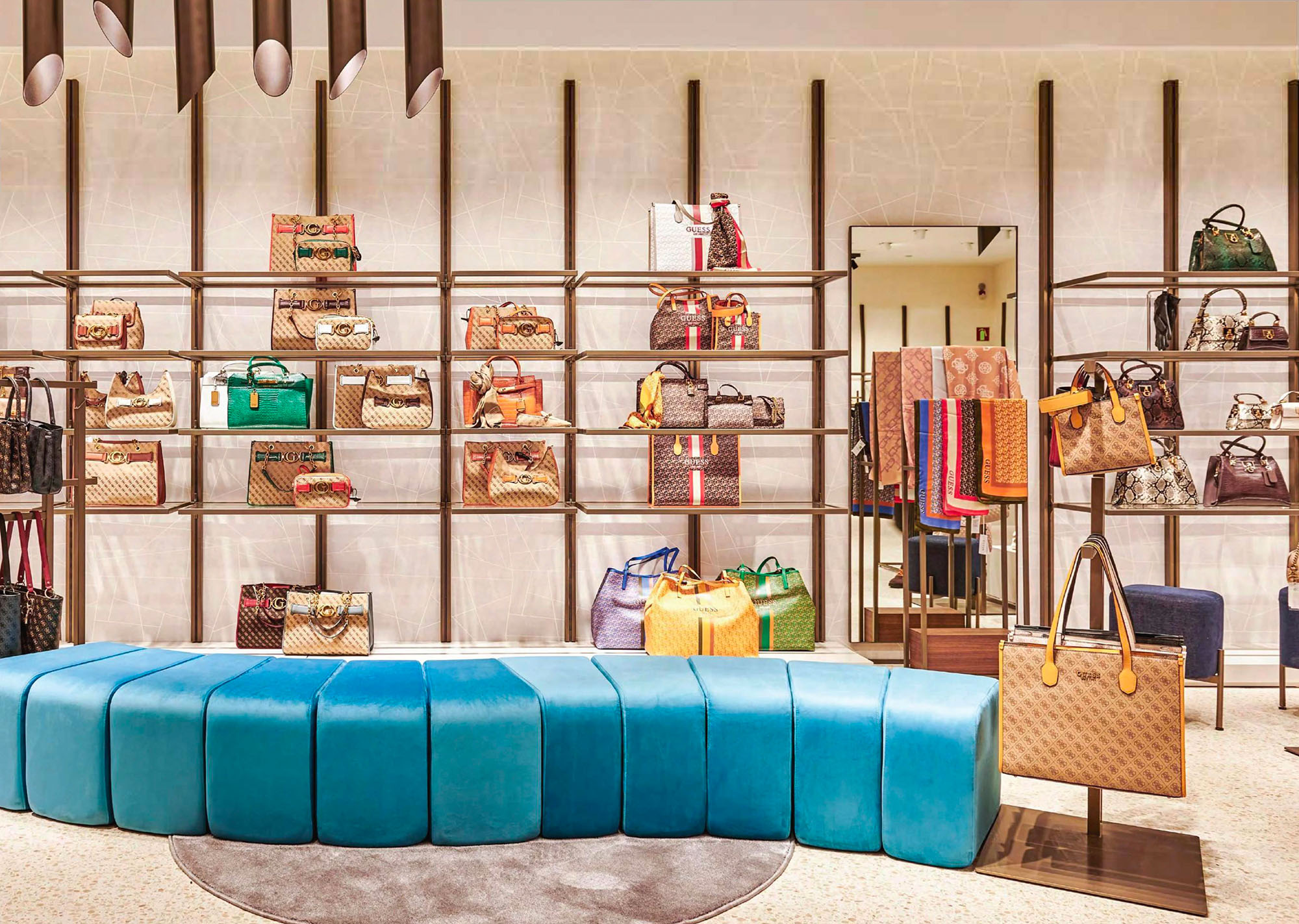 Photo of a Guess retail floor, handbags on shelf